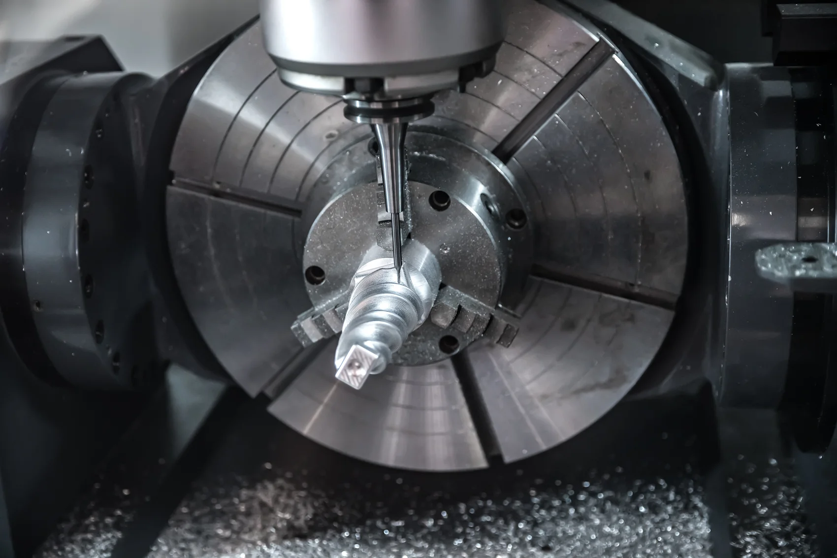 Precision CNC milling machine cutting metal at Dadeks Machine Works